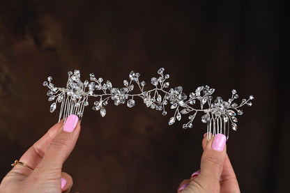 a close up of a person holding a tiara