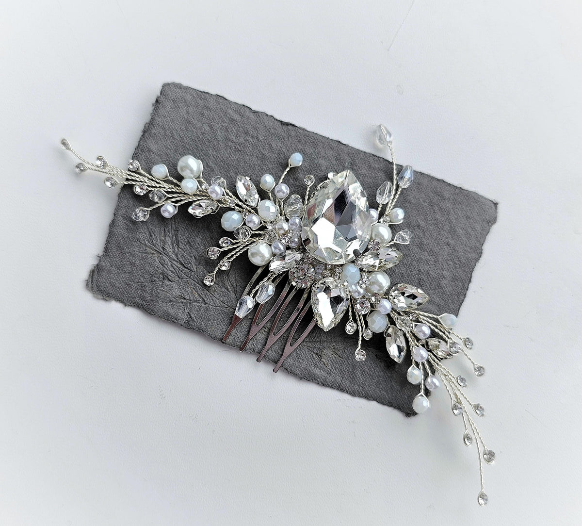 a close up of a hair comb on a piece of cloth