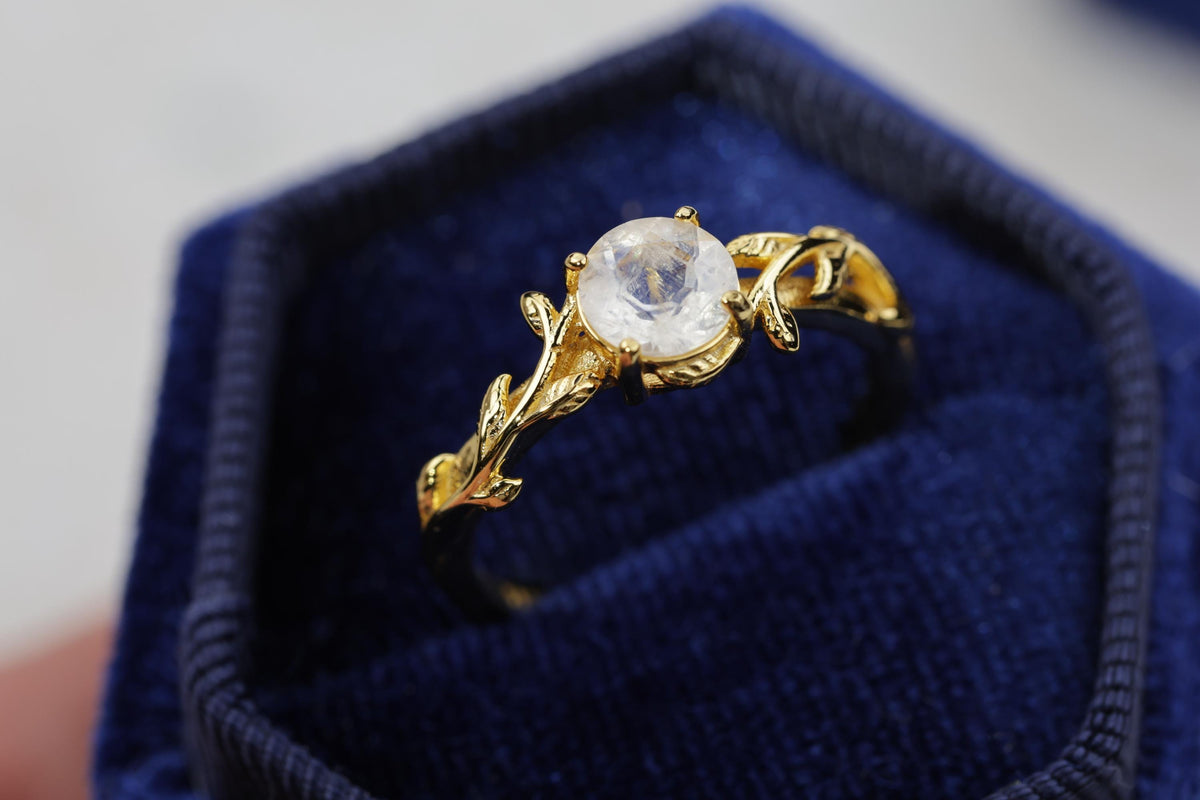 a close up of a ring in a box