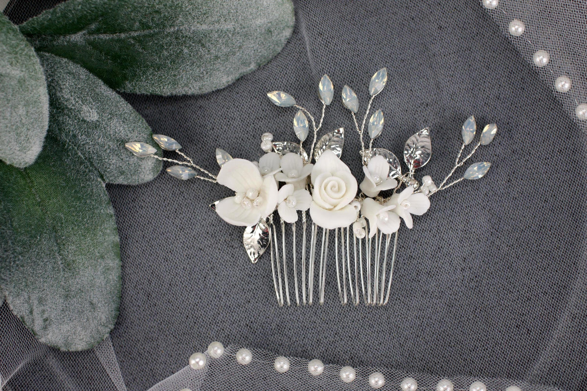 a bridal hair comb with flowers and leaves