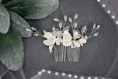 a bridal hair comb with flowers and leaves