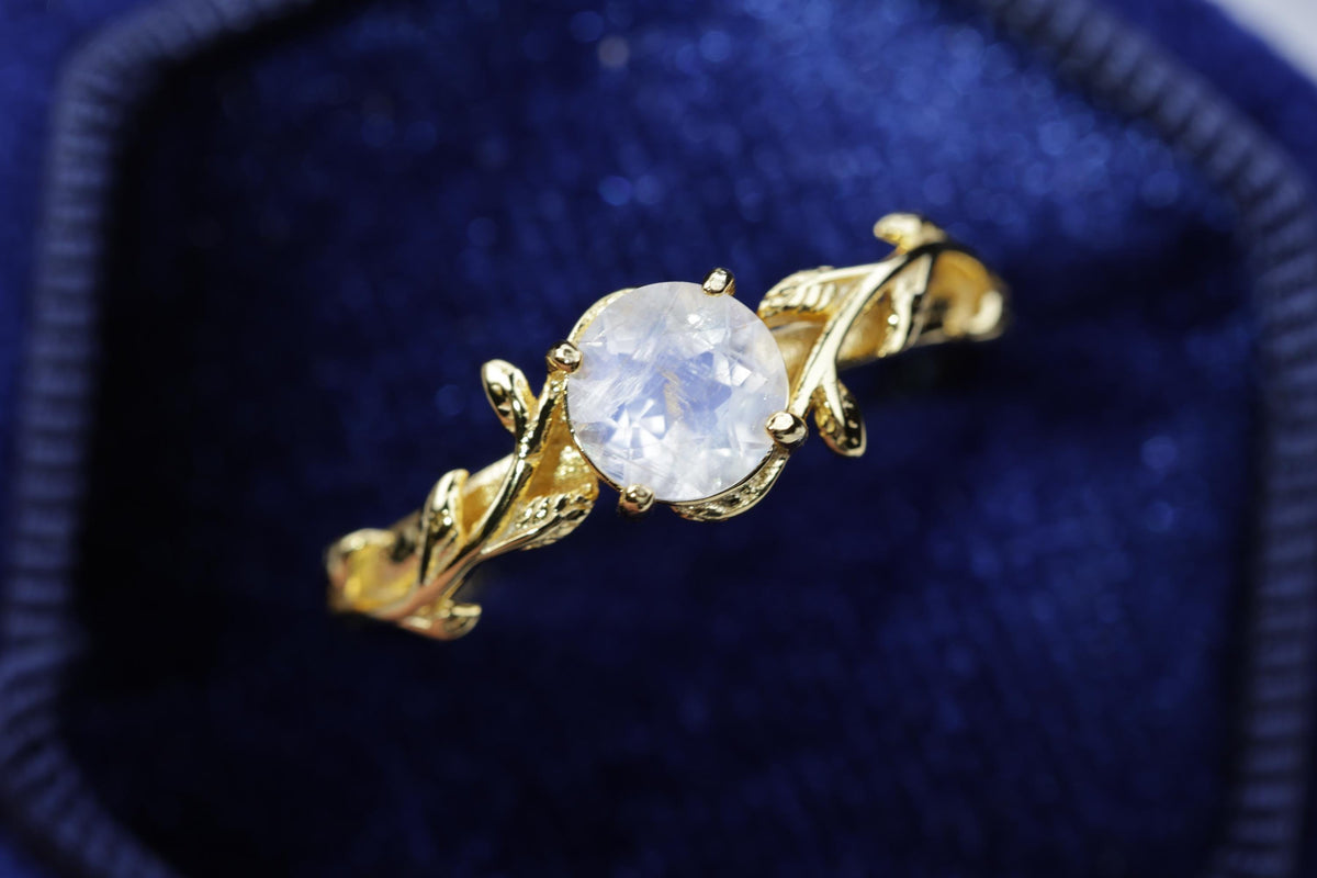 a close up of a ring with a stone in it