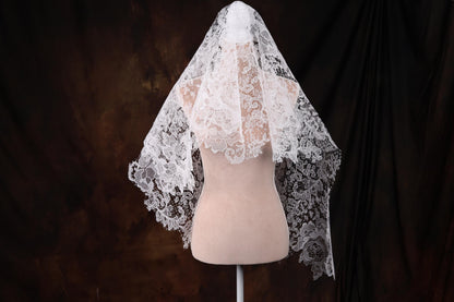 a mannequin with a veil on top of it