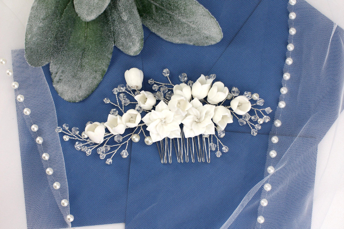 a bridal hair comb with flowers and pearls