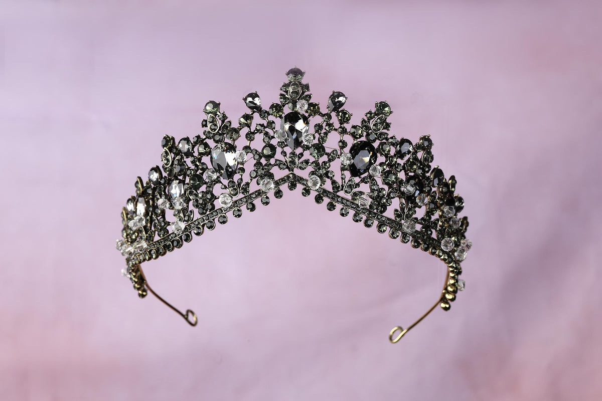 a tiara is shown on a pink background