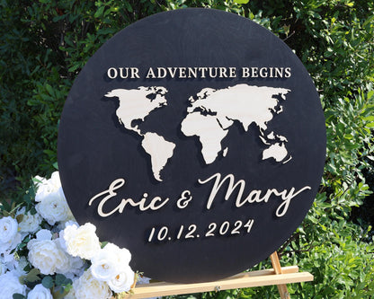 a black sign with a world map on it
