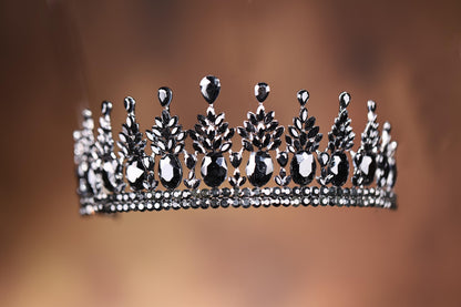 a tiara is shown against a brown background