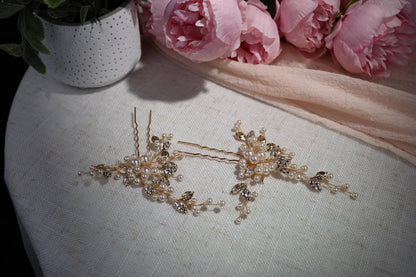 a pair of hair pins sitting on top of a table