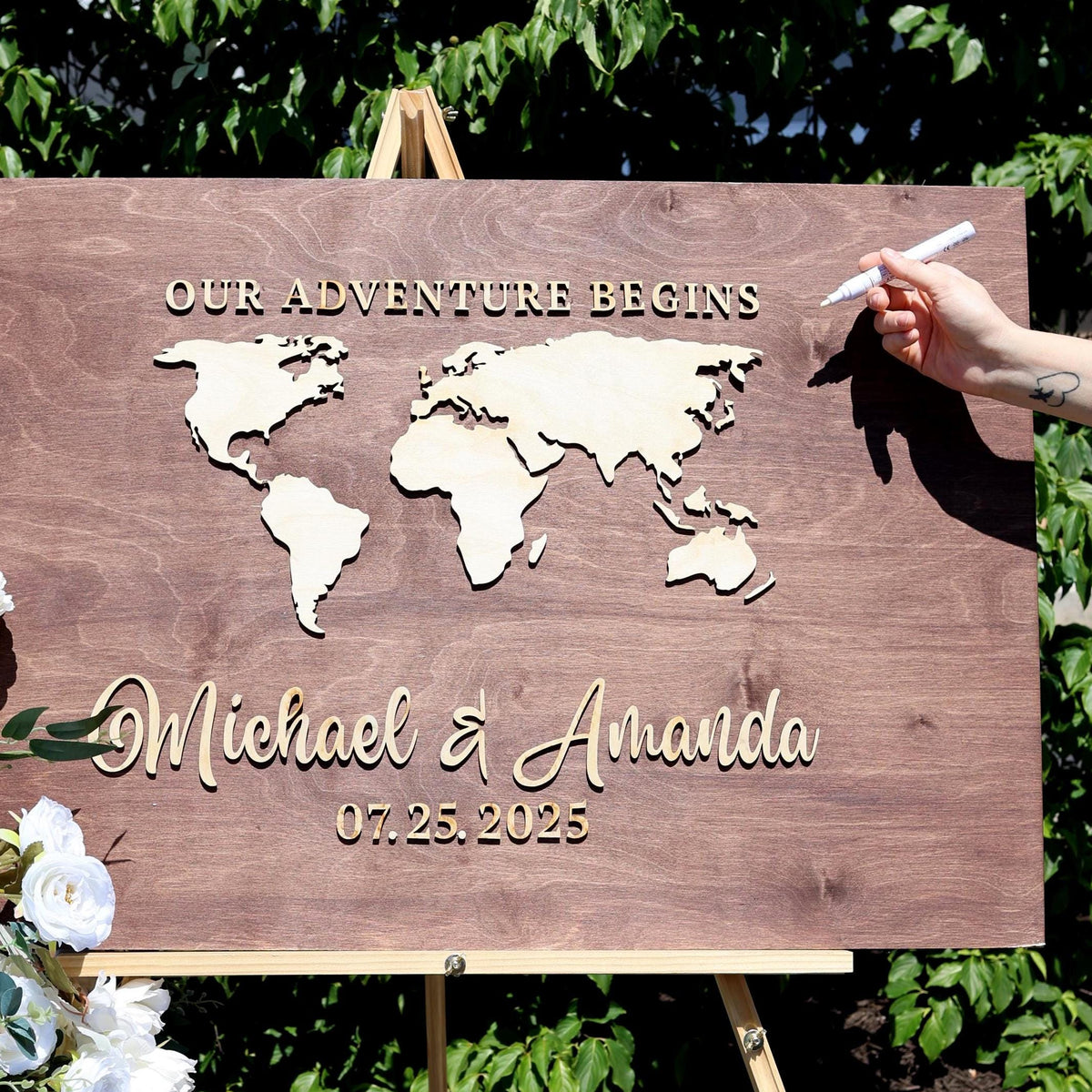 a wooden sign with a world map on it