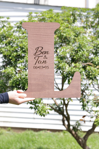 a person holding a cardboard cut out of a dog bone