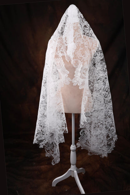 a white veil on a mannequin on a black background