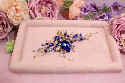 a close up of a brooch with flowers in the background