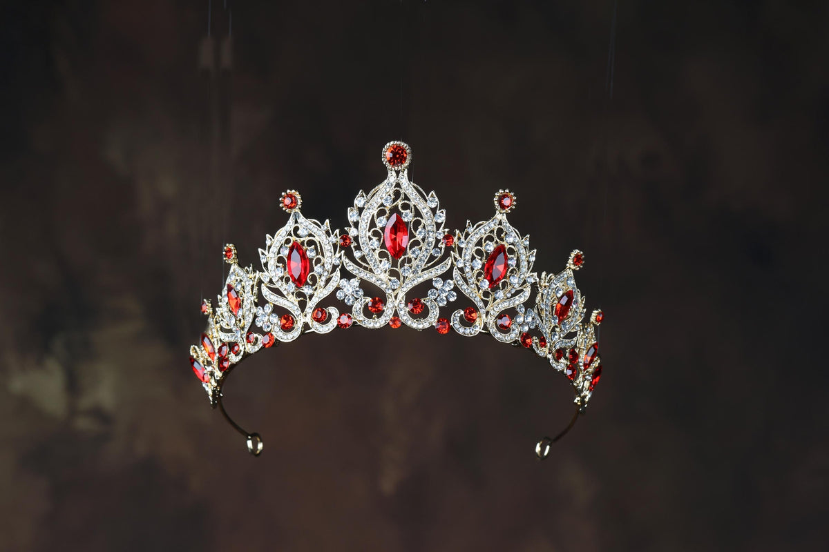 a tiara with red and white stones on it