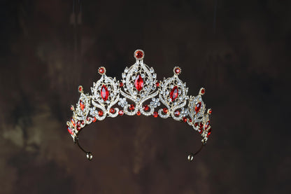 a tiara with red and white stones on it