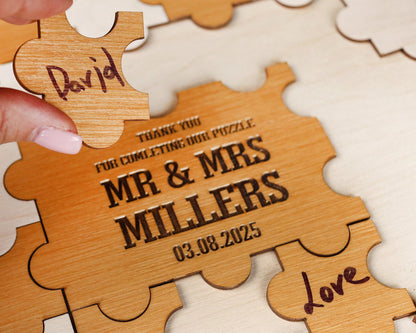 a wooden puzzle with a couple's names on it