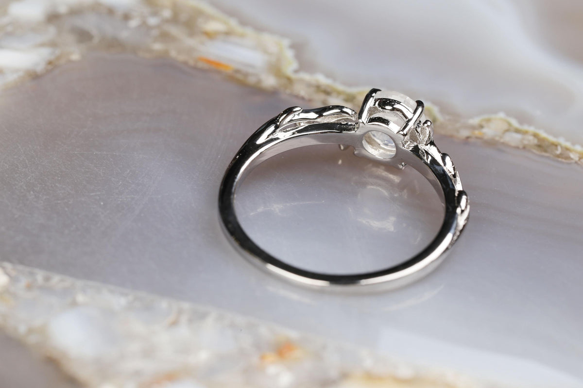 a close up of a ring on a marble surface