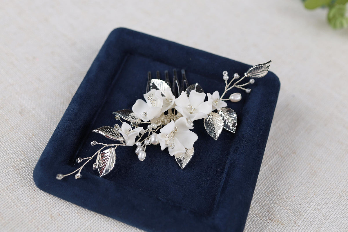 a blue plate with a flower and a comb on it