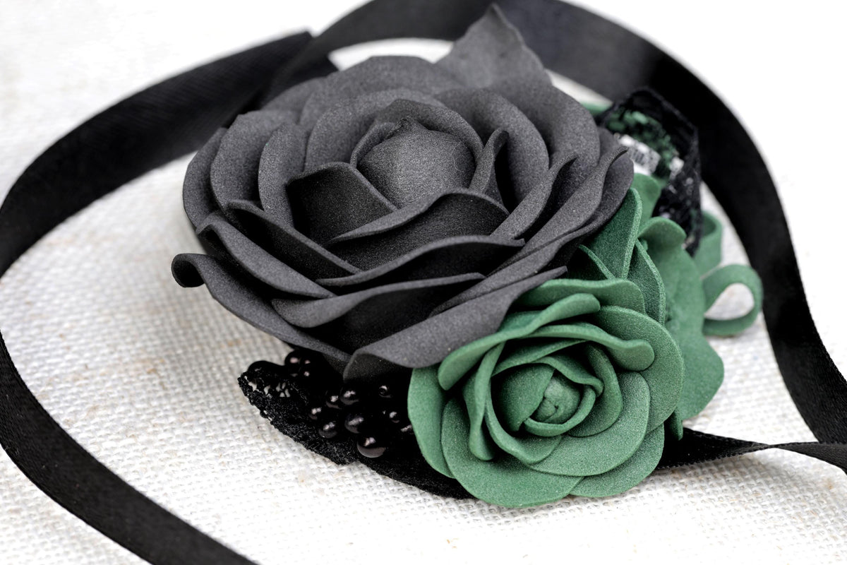 a close up of a flower on a ribbon