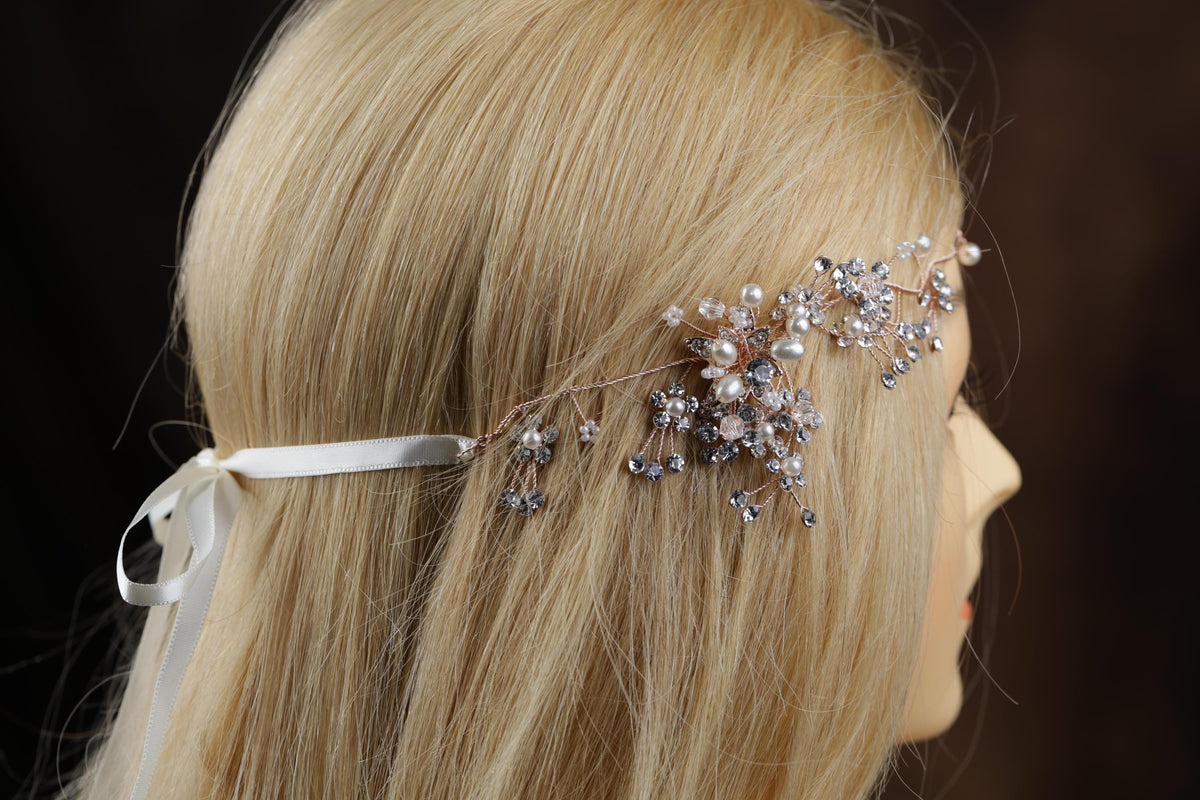a woman with blonde hair wearing a head piece