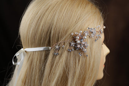 a woman with blonde hair wearing a head piece