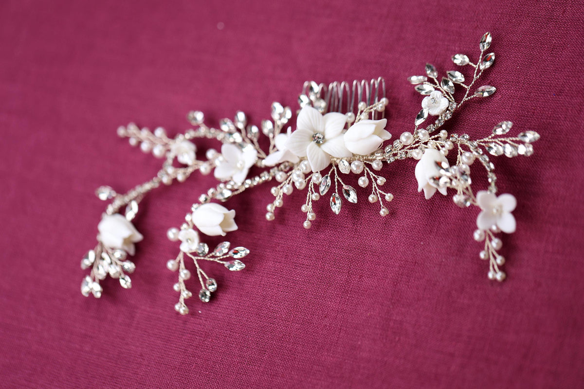 a close up of a hair comb with flowers on it
