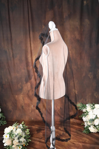 a dress on a mannequin with a veil