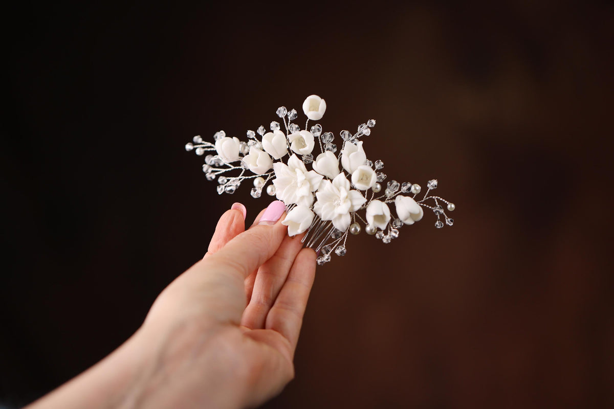 a person holding a bouquet of flowers in their hand
