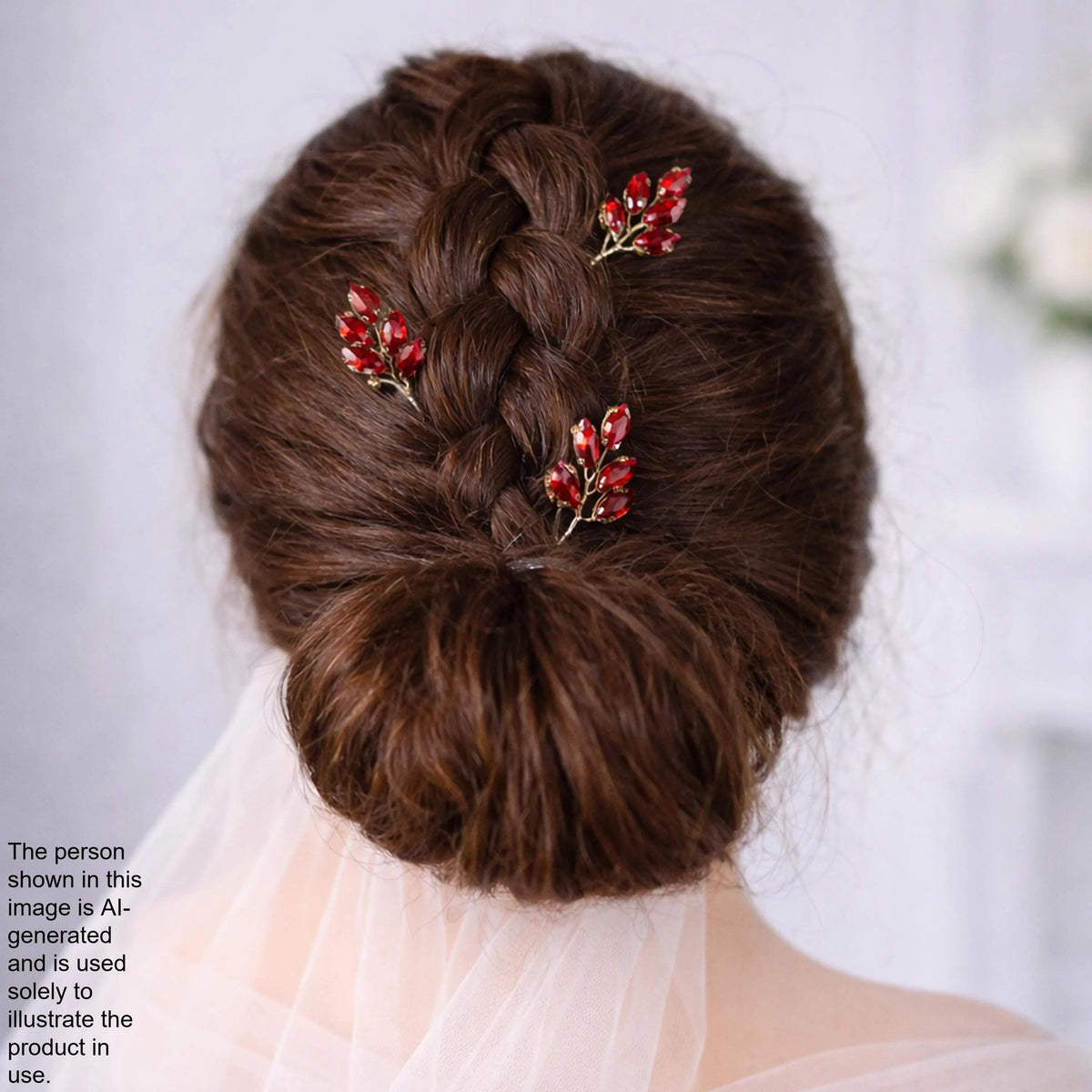 a woman's back view with her hair styled in a bun, adorned with red flower hair clips.