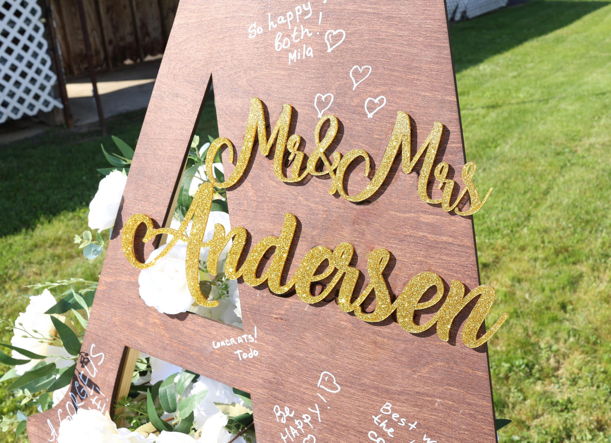 a wooden sign that says mr and mrs anderson