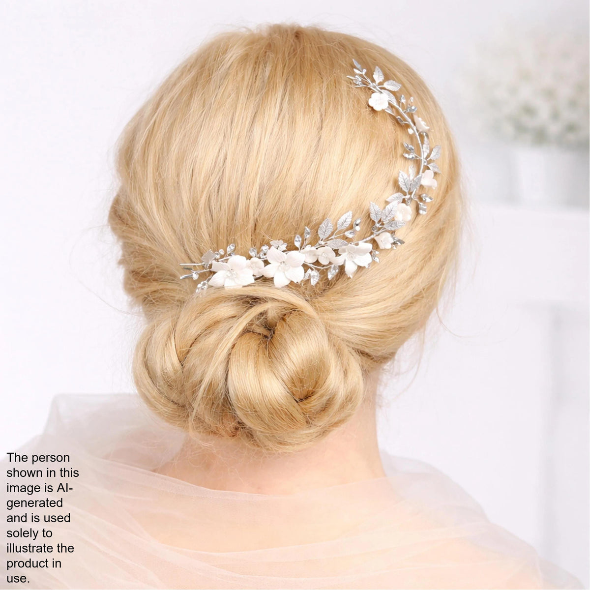 a woman's blonde hair styled in a bun, with a decorative hair accessory featuring white flowers attached to the side of her hair.