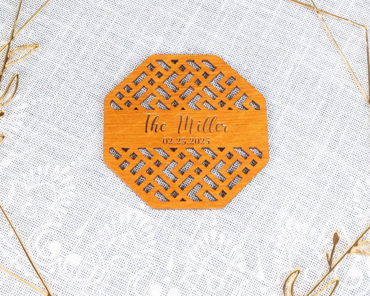 a wooden coaster with the name of the bride on it