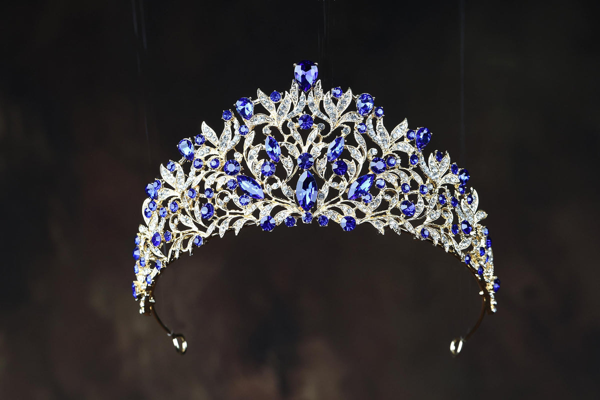 a tiara with blue and white flowers on it
