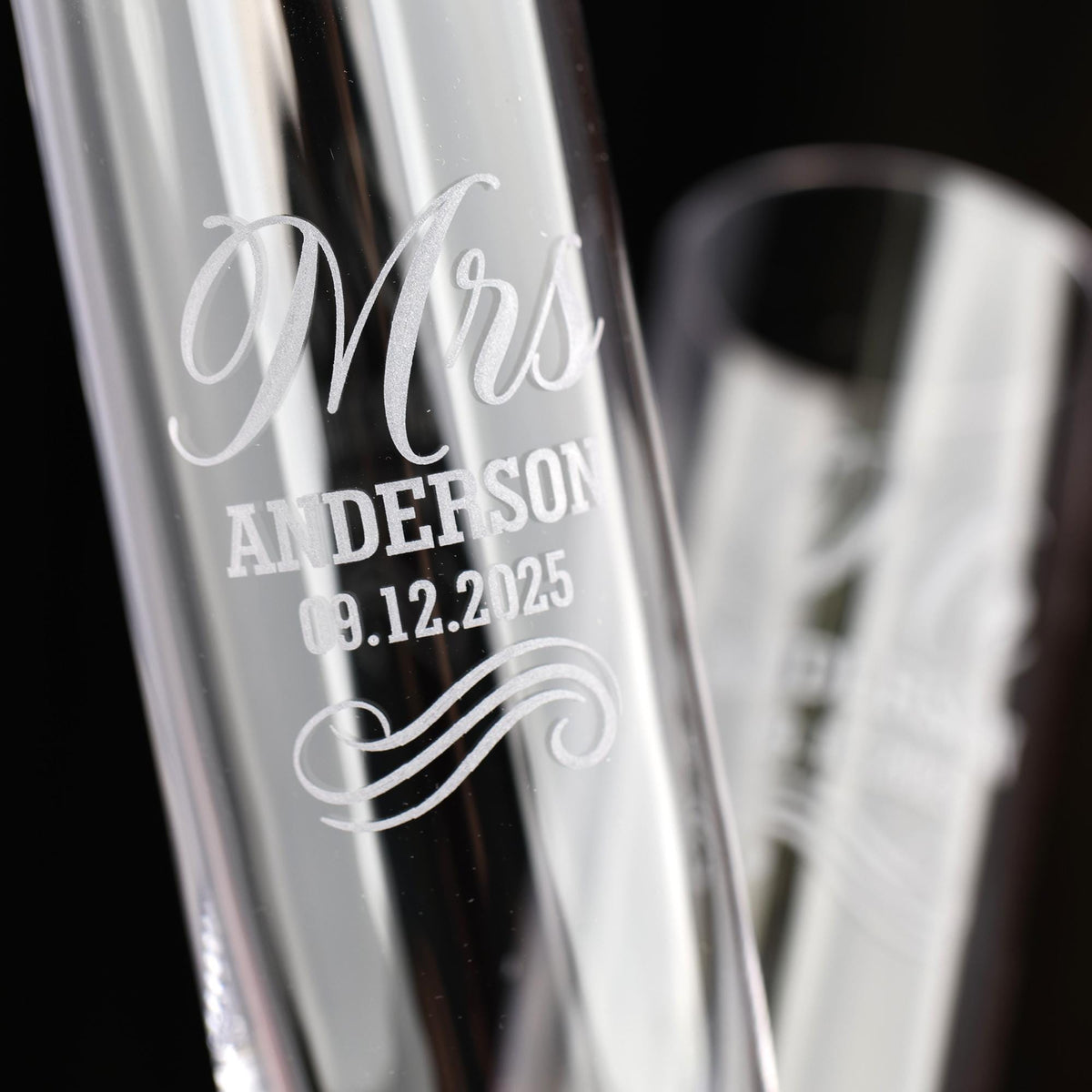 a couple of glass vases sitting on top of a table