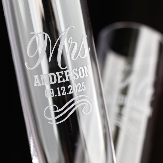 a couple of glass vases sitting on top of a table