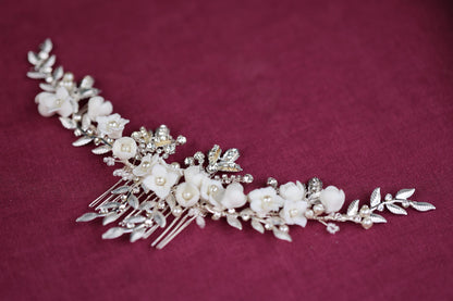 a bridal hair comb with flowers and leaves