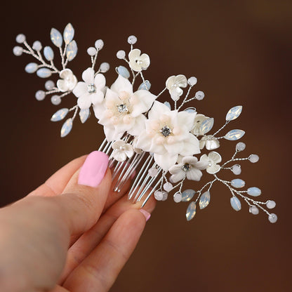 a close up of a person holding a hair comb