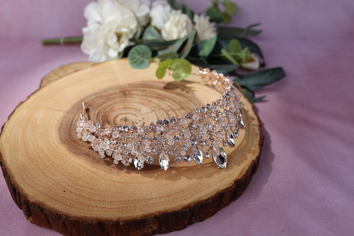 a close up of a piece of wood with a tiara on it