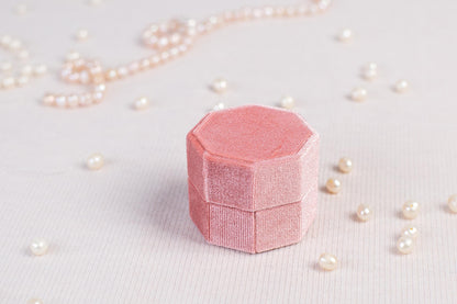 a piece of pink paper sitting on top of a table