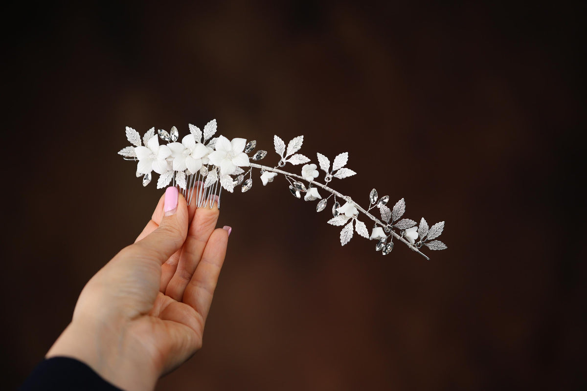 a person holding a flower in their hand