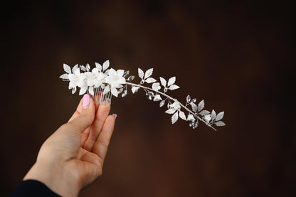 a person holding a flower in their hand